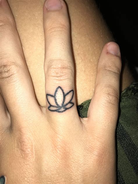 lotus flower tattoo finger